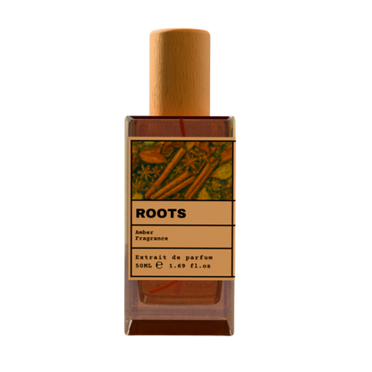 ROOTS Amber Fragrance Extrait de Parfum 50ml bottle with natural wooden cap and cinnamon spice illustration label.